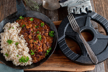 Fitness meal with brown rice and bean stew with ground beef and vegetables