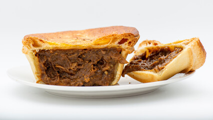 Fresh baked golden flaky chunky curry flavoured pie