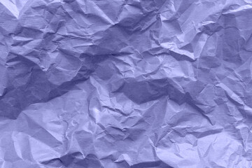 Textured paper background. Recycled paper, crumpled paper. Violet toned. Very peri