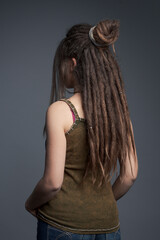 Portrait of young woman,  dreadlocks and long hair￼