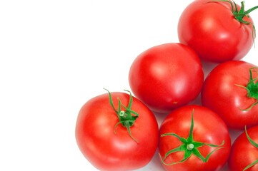 ripe tomatoes on a white background. the concept of cooking tomato sauce. red vegetables on a light texture. juicy pink tomatoes on the table