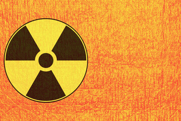 .Black and yellow sign of radiation hazard on an orange background