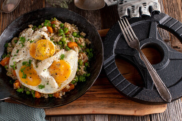 Fitness meal with fried eggs, brown rice and vegetables