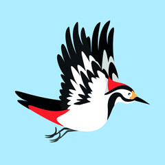 The woodpecker flies and spreads its wings
