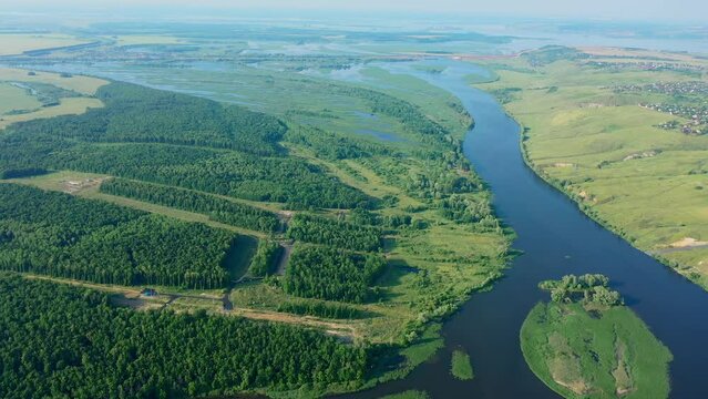 Picturesque views from the air and drone nature of Tatarstan and Russia. Sviyaga River. The river sprouts vegetation. Quiet ples stretch. Panorama for travel and tourism. Berry fields. From above. 