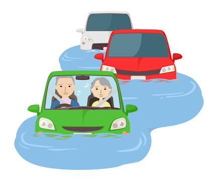 冠水した道路で立ち往生する車と老齢夫婦
