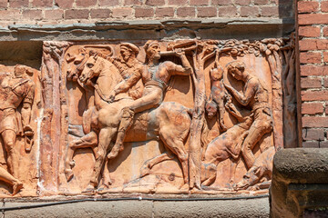 detail of the neo-Gothic fortress that flanks the turret depicting a terracotta bas-relief, Monza Gardens of the Royal Villa. © Xiaoma