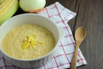 bowl of corn soup with spoon