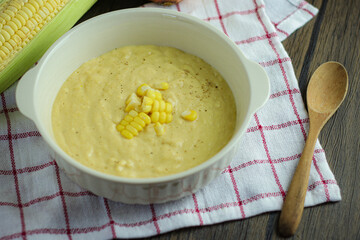 bowl of corn soup with spoon