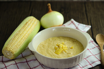 bowl of corn soup with spoon