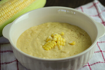 bowl of corn soup with spoon