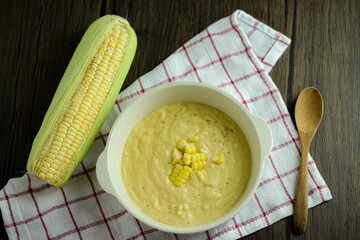 bowl of corn soup with spoon