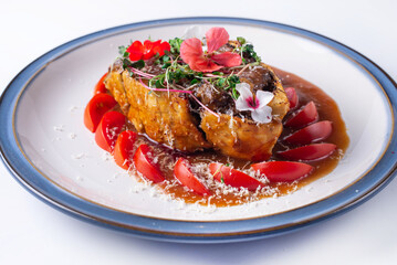 baked beef meat with tomatoes. on a white background