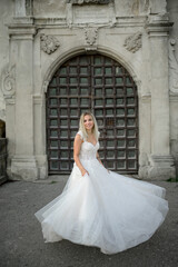 The bride is spinning around with happiness.