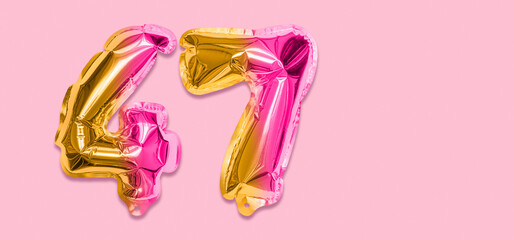 Rainbow foil balloon number, digit forty seven on a pink background. Birthday greeting card with inscription 47. Top view. Numerical digit. Celebration event, template. Banner