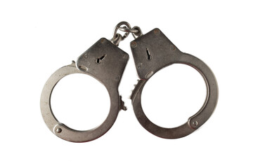 Metal handcuffs with a chain on a light background