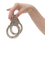 Metal handcuffs with a chain on a light background in a female hand