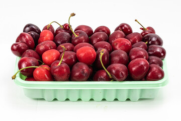 Fresh red color cherry isolated in extendable and easily removable plain background, macro detailing, studio lighting, ample copy space. 