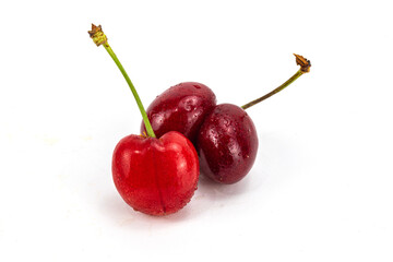 Fresh red color cherry isolated in extendable and easily removable plain background, macro detailing, studio lighting, ample copy space. 