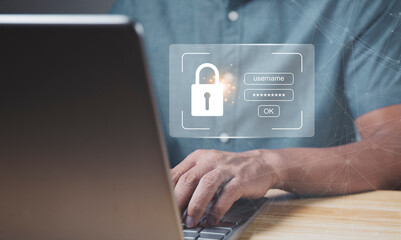 Businessman with a virtual master key for using a notebook computer to enter the password to access...
