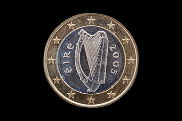 One Euro coin of Ireland (Eire) dated 2005 which shows the Irish Celtic harp on the reverse cut out...