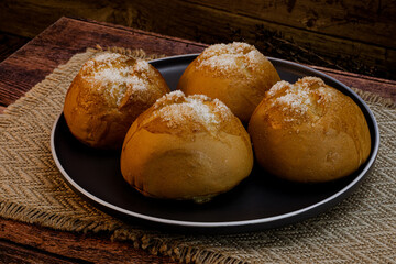 Putak bread on wooden background, studio lighting, macro details, Philippine food