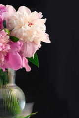 bouquet peony flower in vase on dark background