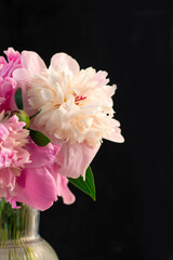 bouquet peony flower in vase on dark background