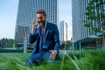 Desperate man crying during bad business. Angry businessman having bad work results. Stressed...