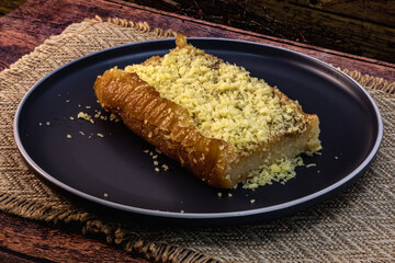 Cassava Cake shot inn wooden background, isolated, no one, studio lighting, macro detailing and ample copy space