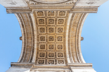 View of the Arc de Triomphe from below in Paris at Chaps Elysees, Paris, France. Architecture and...