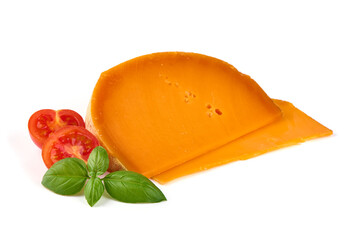 Wedge of orange French Mimolette cheese isolated on white background.