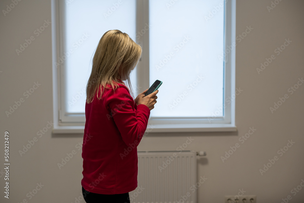Poster woman using a smart phone and sending text message - over white