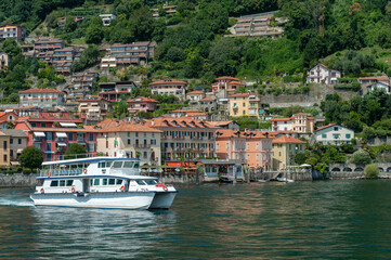 Fototapeta na wymiar Tourist ship on Lake Maggiore in front of Cannero Riviera in northern Italy