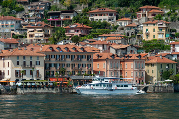 Fototapeta na wymiar Tourist ship on Lake Maggiore in front of Cannero Riviera in northern Italy