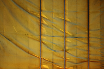 full frame shot of yellow textile on the fence
