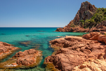 Su Sirboni beach, Sardinia. Marina di Gairo. Crystal clear waters with white sand and red rocks and...