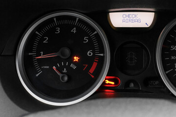 Car dashboard with airbag error warning, malfunction. Car service and repair. The dashboard is...