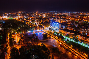 Fototapeta premium Vladikavkaz, capital of North Ossetia at night. Panorama from drone flight