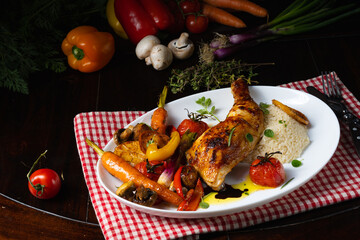 Rustic fried chicken legs with assorted vegetables and rice