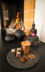 Dessert Chocolate Cake with Nuts in front of Fireplace