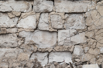 old destroyed wall and plaster on the building