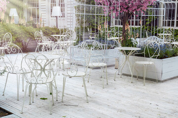 Sunny outdoor cafe with wrought iron furniture