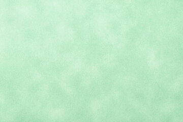 Texture of light green old paper, crumpled background. Vintage olive grunge surface backdrop.