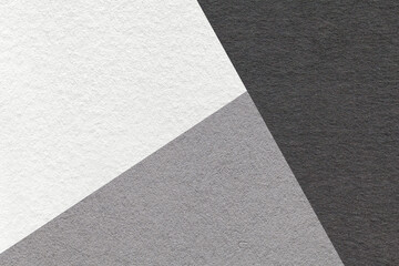 Texture of craft white, gray and black colors paper background, macro. Structure of vintage grey dense craft cardboard