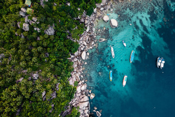 Bay and boats form above in island