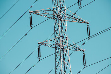 An electric pole with wires transmits energy to consumers. Infrastructure and industry