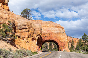 red rock tunnel and arch on the way to the Bryce canyon, USA
