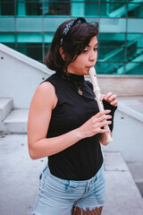 Girl playing music in stairs