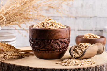 Rolled oats on wooden background